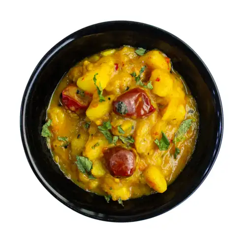 Aaloo tarkari add-on served in a black bowl
